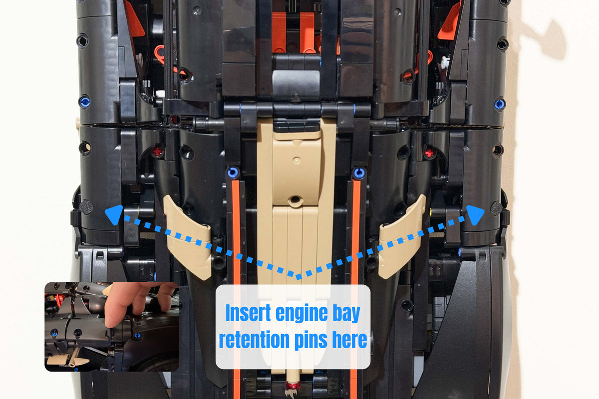 Guide showing where to fit the engine bay retention pins on LEGO Technic Koenigsegg Sadair's Spear 42232.