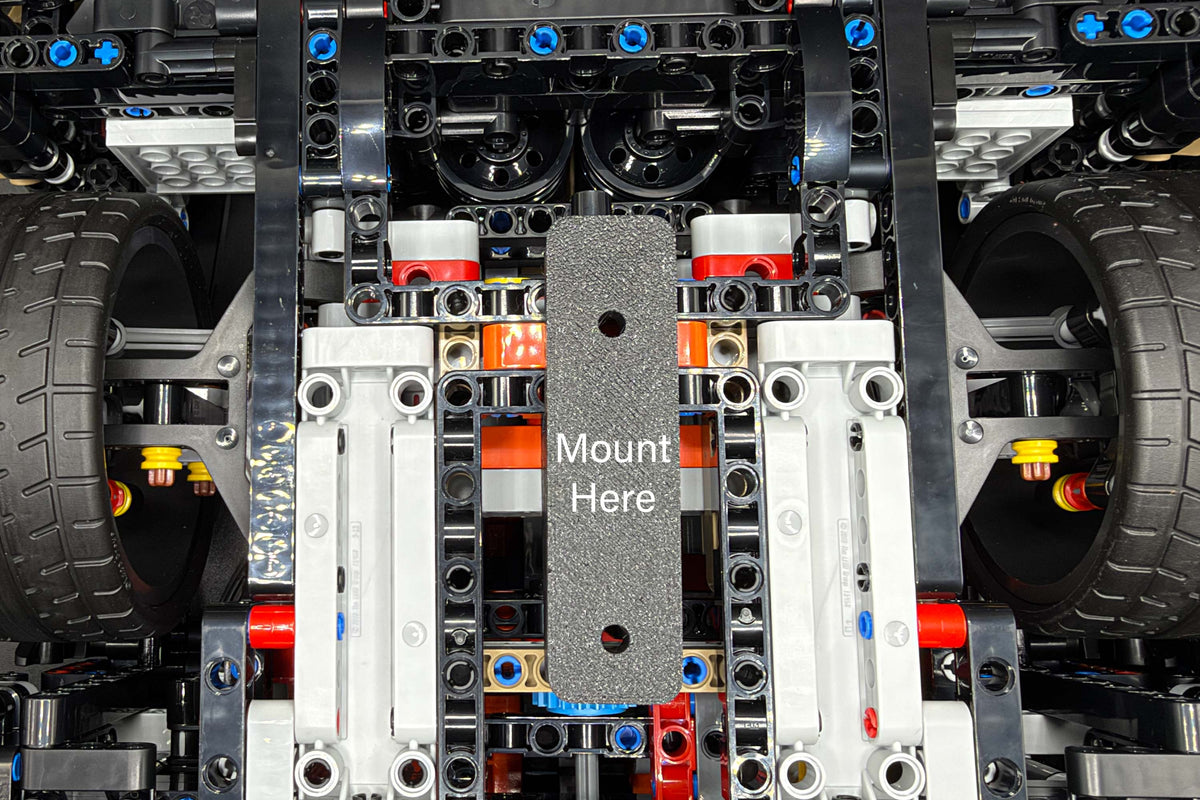 Underside of LEGO Technic Koenigsegg Sadair's Spear 42232 showing the wall mount bracket position.